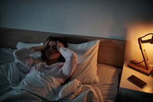 Image of tired woman in bed